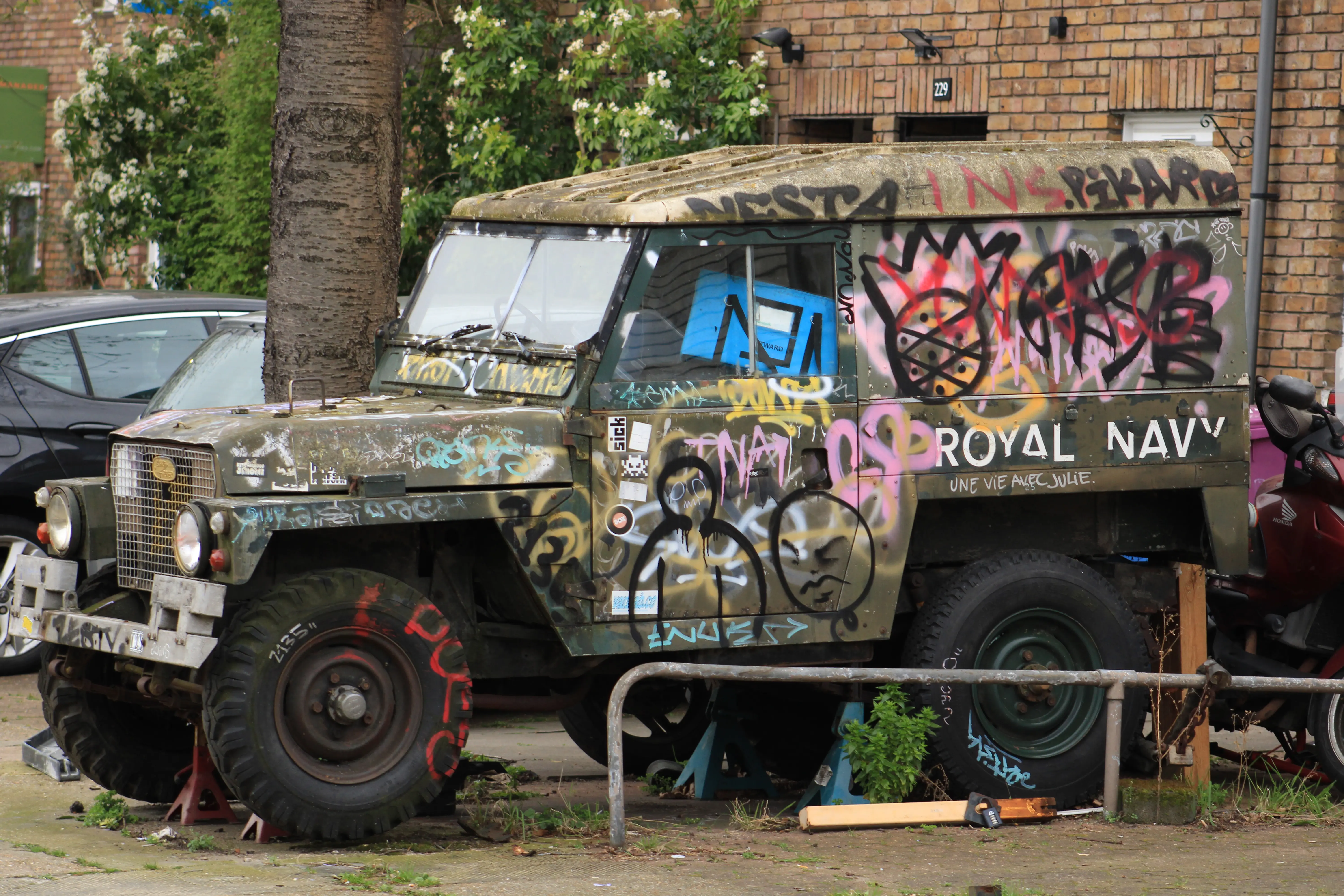 A photo of a grafitied car